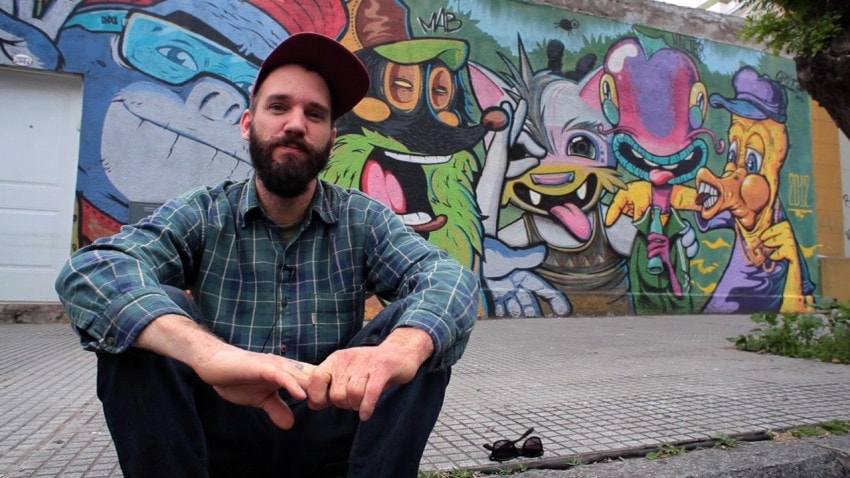 Mab in front of one his street art creations