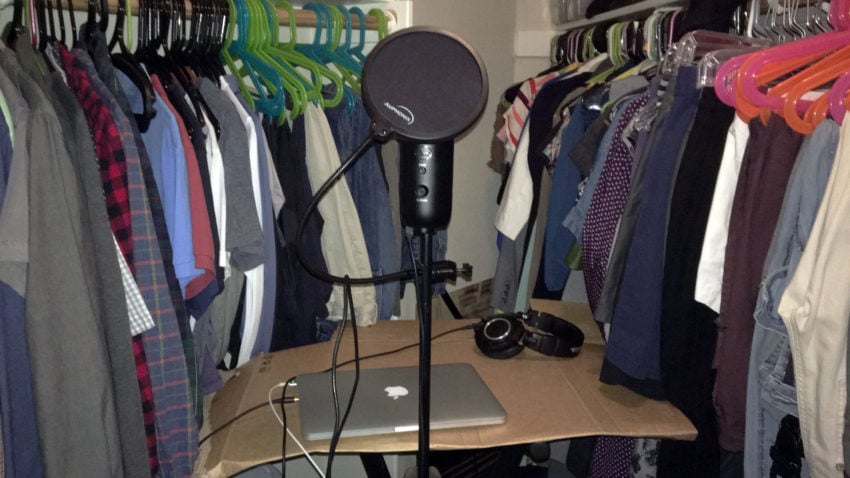 Blue Yeti mic hooked up to a MacBook Pro resting on a piece of trash.